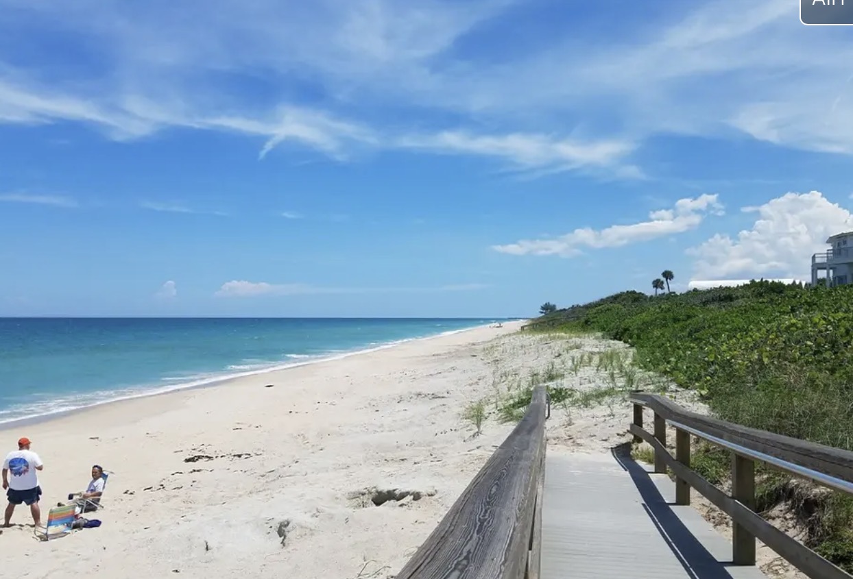 Beach and ocean viewed from a boardwalk